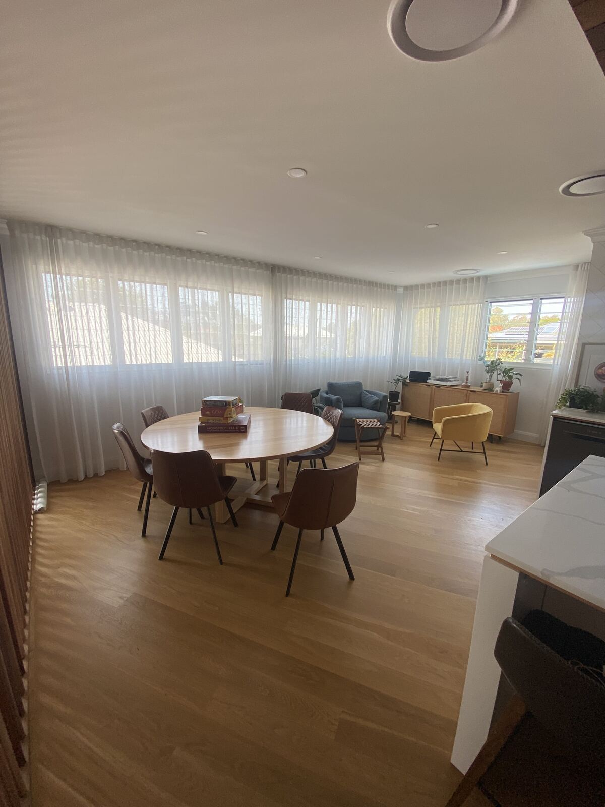 Sheer curtains in an open-plan dining and living room